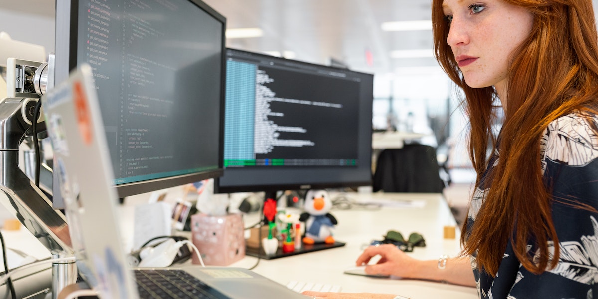 Women setting up a robotics programming environment